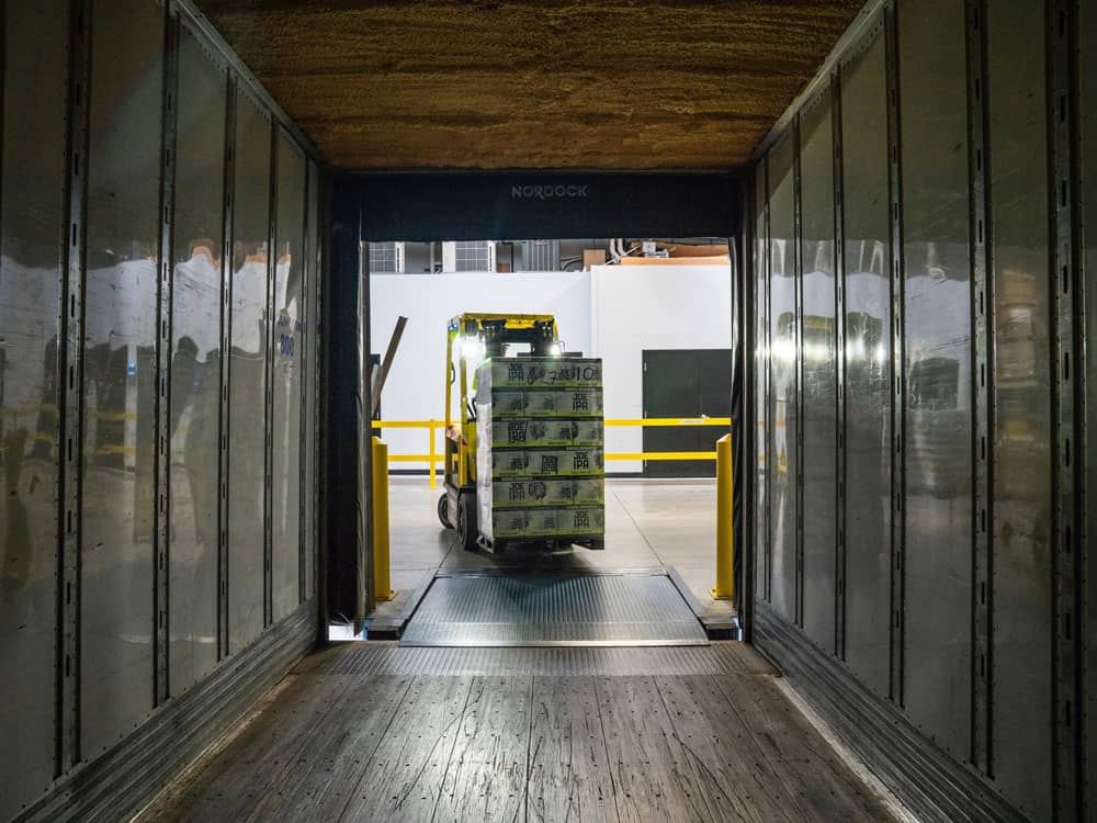 warehouse-management-002-d365-experts warehouse management system helping team with deliveries onto lorries